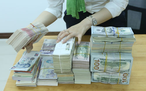 Sau khi gián đoạn từ cuối tháng 2/2017, có thể Pg88 com chính chủ Nhà nước sẽ trở lại mua vào ngoại tệ, gia tăng dự trữ ngoại hối - Ảnh: Quang Phúc.<br>
