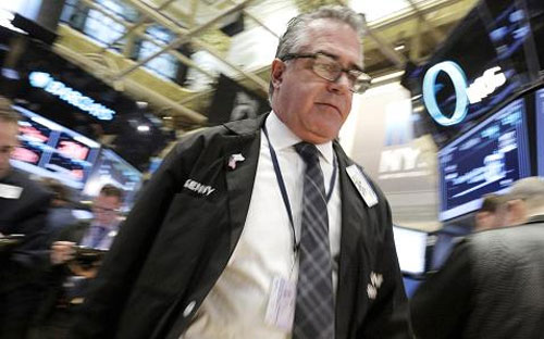 Một nhà giao dịch 6Pg88.com nhà cái trên sàn NYSE ở New York - Ảnh: CNBC/Reuters.<br>