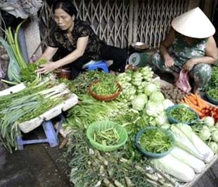 Việc CPI tăng trong khoảng 1% ở hai thành phố lớn được các cơ quan công bố các con số này giải thích là do giá cả tăng cao trong tháng có Tết - Ảnh: AP.