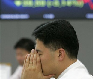 Dù không giảm điểm mạnh như phiên buổi sáng, nhưng dư âm của vụ thử hạt nhân của Triều Tiên cũng khiến không ít nhà đầu tư lo lắng - Ảnh: AP.