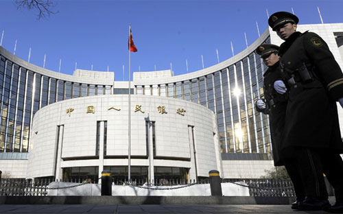 Bên ngoài trụ sở Pg88 com chính chủ Trung ương Trung Quốc (PBoC) ở Bắc Kinh - Ảnh: AFP.<br>