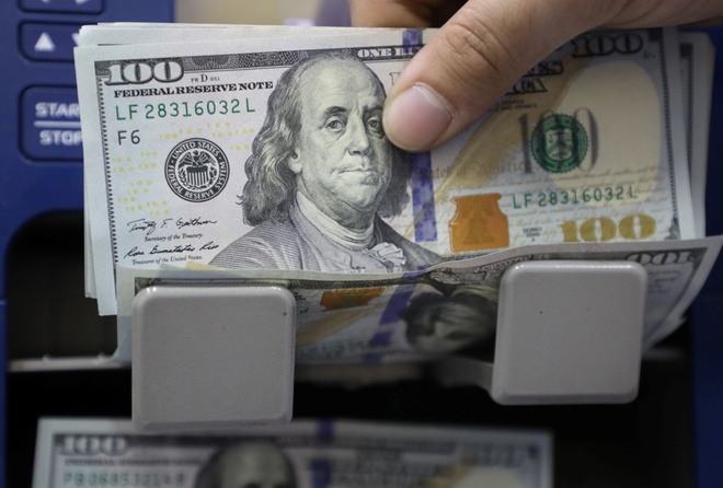 Người nghèo nhất kiếm được một USD, thì một tỷ phú đã kiếm được gần 1,7 triệu USD. Ảnh: Reuters